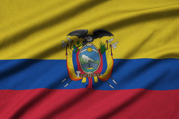 Ecuador flag  is depicted on a sports cloth fabric with many folds. Sport team banner