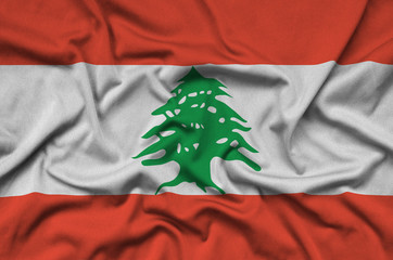 Lebanon flag  is depicted on a sports cloth fabric with many folds. Sport team banner