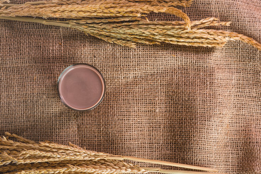 Glass Of Chocolate Malt Milk On Sackcloth, Top View