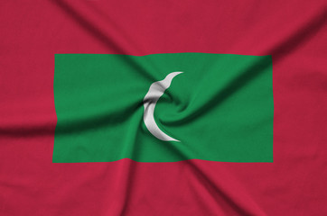 Maldives flag  is depicted on a sports cloth fabric with many folds. Sport team banner
