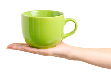 Green cup mug in hand on white background isolation