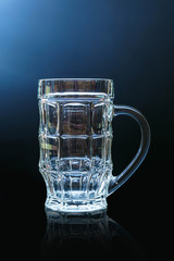Empty beer glass isolated on black background.
