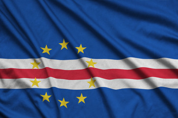 Cabo verde flag  is depicted on a sports cloth fabric with many folds. Sport team banner