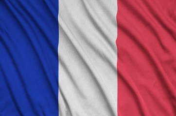 France flag  is depicted on a sports cloth fabric with many folds. Sport team banner