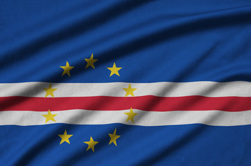 Cabo verde flag  is depicted on a sports cloth fabric with many folds. Sport team banner