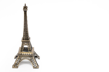 miniature model of a golden Eiffel tower on a white background (mock-up)