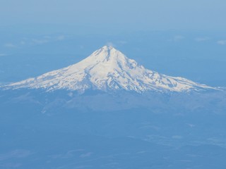 Fototapeta na wymiar snow capped mountain from plane