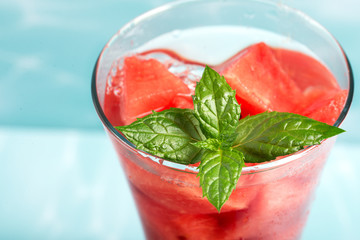 Cocktail of watermelon with a mint leaf, close-up.
