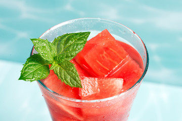 Cocktail of watermelon with a mint leaf, close-up.