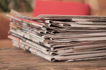 Old newspapers on wooden table