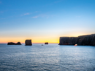 Dyrholaey arch with hole in evening of Iceland