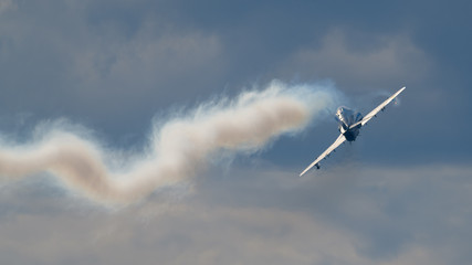 Fototapeta na wymiar Airplane and smoke at air show