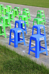 Plastic stools in the square in a park