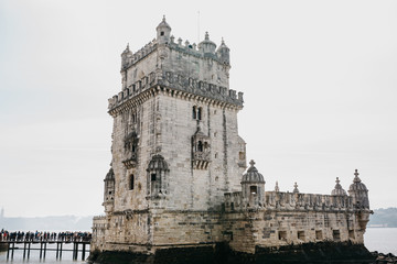 Fototapeta na wymiar Torre de Belem or the Belem Tower is one of the attractions of Lisbon. The fortress was built in 1515-1521. This is one of the favorite places for tourists to visit the city.