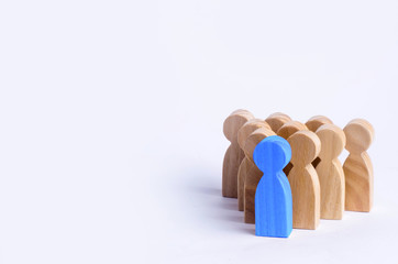 People stand in the formation of the pins. A game of bouwling. Wooden figures of persons, on a...