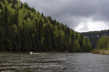 landscape of the Ural river Usva, the Chusovaya tributary, with picturesque wooded coastal cliffs...