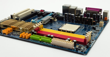 Motherboard with visible PCI express connector slot, heat sink, memory slot, cpu socket in blue.