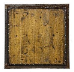 a wooden board made of wooden planks in a rusty metal frame with rivets isolated on white background