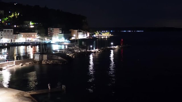 Time lapse of the harbor in Piran, Slovenia at night in 4K resolution