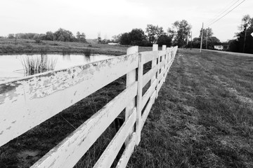 White picket fence, black and white, farm, pond
