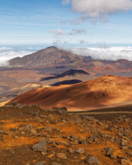 Wide volcanic landscape with lava fields in different colors, wide view, ocher shades, reds, stones...