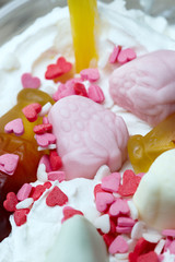 Decoration of a milkshake with confectionery. Cold sweet dessert.