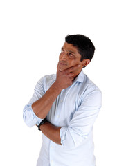 Serious looking confused man standing