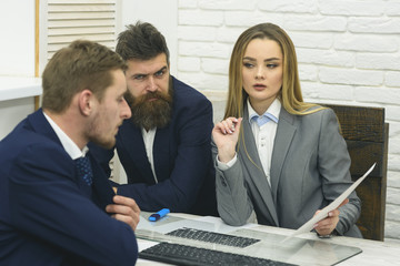 Business partners or businessmen at meeting, office background. Business consulting concept. Woman lawyer or accountant consulting entrepreneurs. Business negotiations, discuss conditions of deal