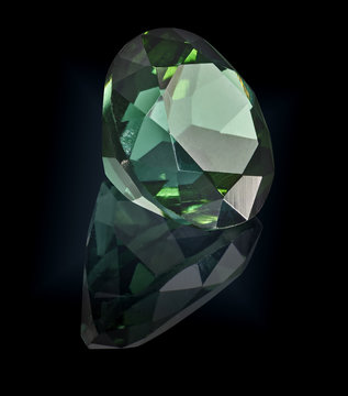 Tourmaline Gem Stone Isolated On Black Background