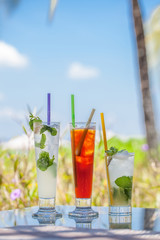 Three beautiful exotic coctail in nature background