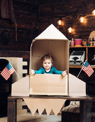 Education and kid idea development. Happy independence day of the usa. Small boy play in paper rocket, childhood. Dream about career of cosmonaut. Earth day concept Patriotism and freedom