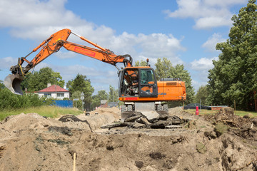 excavator work on construction site, street reconstruction