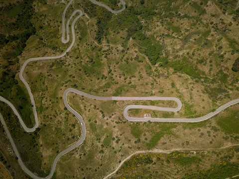 Mountain road birds eye view from high beyond the way and hill
