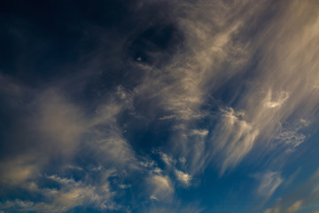 Fototapeta na wymiar Bright clouds in the twilight sky.