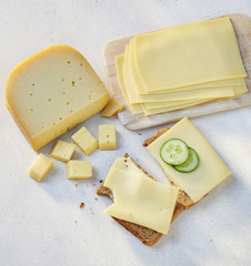 cheese pieces and slices on a slice of bread