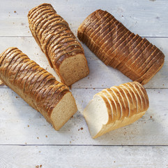 loaf of bread white and brown on wood