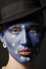 Woman face with painted Flag of European Union