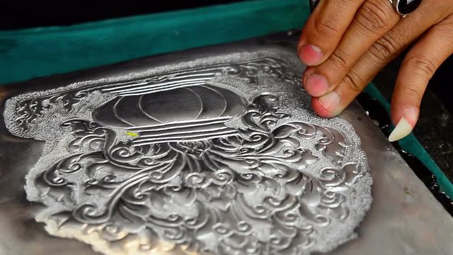 The art and pattern of carving silverware. Demonstration of the silverware of the Northerners, Thailand. Thai handicraft style.
