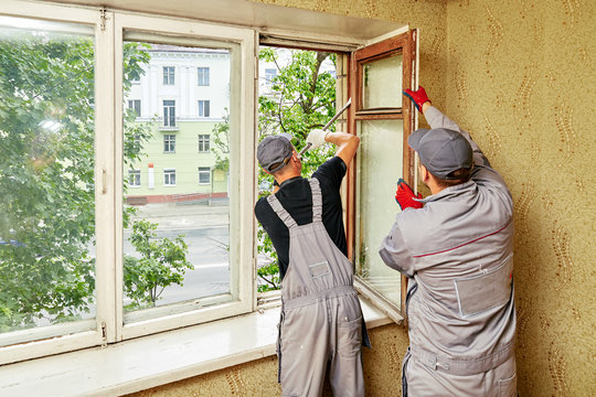 man expands window for repairs