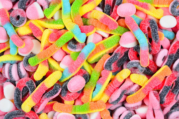 Assorted colorful juicy gummy candies. Top view.