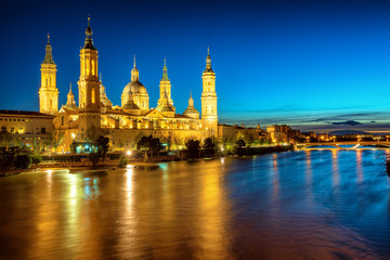Fototapeta premium Zaragoza city, Spain, view over river to Cathedral at evening