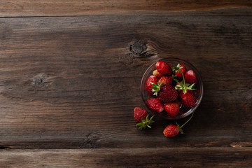 Fresh strawberries. Healthy food. On Wooden background. Top view. Free space.