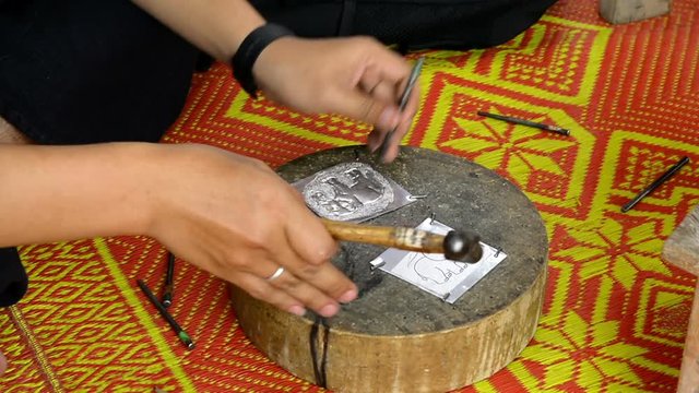 The art and pattern of carving silverware. Demonstration of the silverware of the Northerners, Thailand. Thai handicraft style.