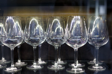 glass wine glasses stand in a row
