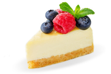 Cheesecake with fresh berries and mint leaves isolated