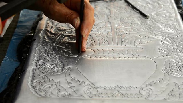The art and pattern of carving silverware. Demonstration of the silverware of the Northerners, Thailand. Thai handicraft style.