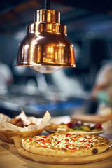 Hot Italian pizza is only from the oven in the oven. selective focus, copy space.