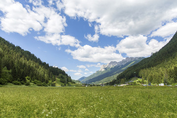 Moena, Trentino Alto Adige, Dolomites, Alps, Italy - June 19, 2018: Beautiful view of the town of Moena in the Dolomite mountains, Italy. Old town in the Italian Alps