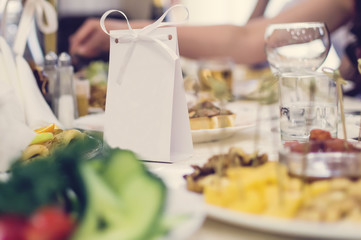 Dishes and food on the festively served table in the restaurant.