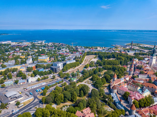 Amazing aerial view of the Tallinn old town with many old houses sea and castle on the horizon.
